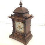 A 19th century German oak-cased mantel clock, with gilt-brass dial, the silvered chapter ring with