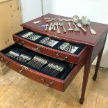 A table canteen containing a Hanoverian pattern silver flatware service, hallmarked for Harrod's