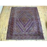 A Mashwani rug, with radiating centre diamond shaped medallion and running dog border, enclosed