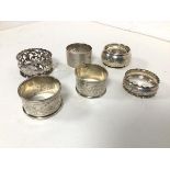 A collection of six Birmingham silver napkin rings, early 20thc. (combined: 96.80g)