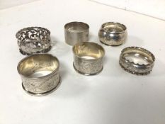 A collection of six Birmingham silver napkin rings, early 20thc. (combined: 96.80g)