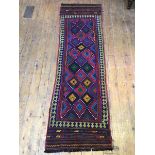 An old Suzani kelim runner, the central field with multiple diamonds in vibrant colours, within a