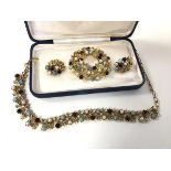 A group of costume jewellery by Jewelcraft including necklace, clip on earrings and brooch (