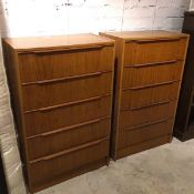 A pair of mid century Danish tall chests of drawers, each fitted five drawers and stamped Danish