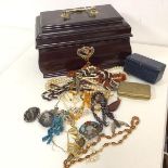 An assortment of costume jewellery including necklaces, brooches, pendants, two niello silver