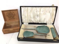 A 1930s/40s vanity set with hand mirror, hair brush and clothes brush, all with guilloche backs,