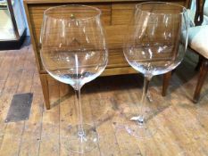 A pair of monumental sized wine glasses (75cm x d.27cm)