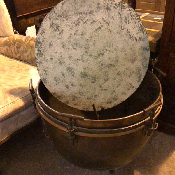 A copper drum lacking skin, converted to coffee table, with mottled painted top (57cm x d.68cm)