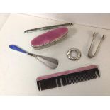 Assorted silver items including a silver guilloche handled shoe horn, an oval jar, handle and