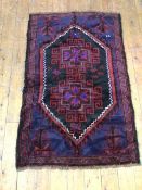 An old Baluchi rug, the central medallion with geometric and foliate decoration, the medallion and