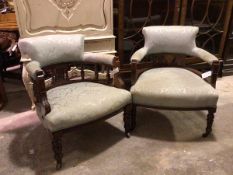 Two Edwardian tub library chairs, both in a eggshell blue damask foliate upholstery, on turned front