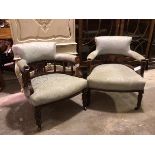 Two Edwardian tub library chairs, both in a eggshell blue damask foliate upholstery, on turned front