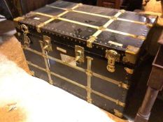A vintage style travelling trunk with gilt metal mounts and four latches to front, lacking key (63cm
