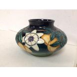 A Moorcroft passion fruit pattern squat vase with Iron date mark to base and 96 (12cm x 19cm)