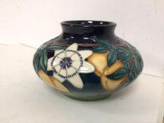 A Moorcroft passion fruit pattern squat vase with Iron date mark to base and 96 (12cm x 19cm)