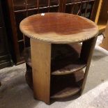 A modern mahogany circular occasional table, the circular top with moulded edge above two lower