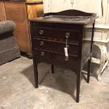 A modern Georgian style music cabinet with ledge back, top above three fall front drawers on