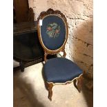 A Victorian mahogany bedroom chair, with large balloon back having a shell and flower carved crest