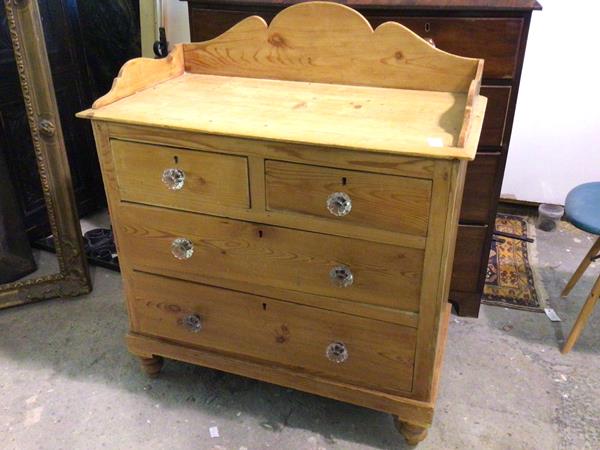 A Victorian pine washstand, with moulded ledge back and sides above two short drawers and two long