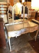 A Louis XV style dressing table with bevelled glass triptych mirror above an arrangement of drawers,