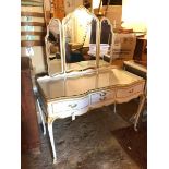 A Louis XV style dressing table with bevelled glass triptych mirror above an arrangement of drawers,