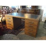 A 1930s/40s cherrywood pedestal desk with black leather skiver and fitted four drawers to either