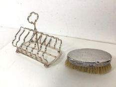 An Edwardian Birmingham silver backed clothes brush (13cm x 7cm) and an Epns large toastrack on