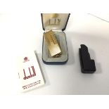 A Dunhill gilt metal lighter with original box and instructions (lighter: 6.5cm)
