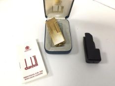 A Dunhill gilt metal lighter with original box and instructions (lighter: 6.5cm)