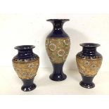 An early 20thc Royal Doulton vase of baluster form with flared rim and foot, navy blue glaze and