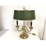 A brass Bouillotte table lamp with painted metal shade, scroll arms and circular base (55cm x 40cm x