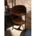 An Edwardian mahogany corner washstand, the high galleried back with corner shelf, with single tier,