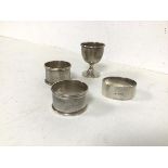 A collection of three Birmingham silver napkin rings and a Birmingham silver egg cup (combined: 61.