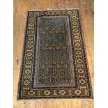 A North West Persian rug, the central panel with multiple stylised flowers in blues and yellows,