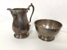 A white metal jug with handle and a footed bowl, both marked silver, with other markings (jug: 14cm)