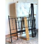 A brass and painted metal bed frame, the spindles on head and footboard topped with stylised