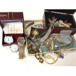 A group of costume jewellery with some silver including necklaces, paste pearls, watches, charms