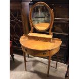 A demi lune dressing table, the superstructure with oval bevelled mirror on base fitted two short