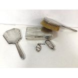 A 1930s/40s London silver hairbrush and hand mirror, together with a silver combination match holder