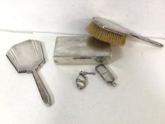 A 1930s/40s London silver hairbrush and hand mirror, together with a silver combination match holder