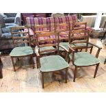 A set of six G Plan elm dining chairs with ladder backs and olive green upholstered seats, on