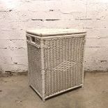 A wicker laundry basket with hinged lid and handles to side, painted white (66cm x 54cm x 39cm)