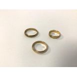 Three 9ct gold wedding bands (largest: W) (combined: 8.48g)