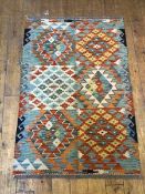 A Chobi kelim rug, with six panels with geometric design, within a running dog border (120cm x