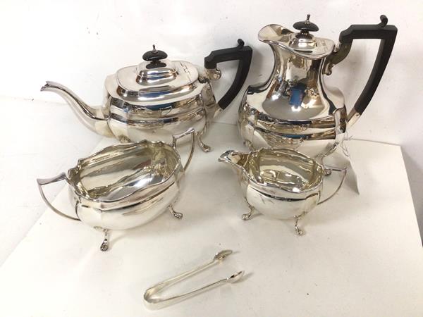 An Epns tea and coffee service with teapot, coffee pot (21cm), milk jug, sugar bowl, sugar nips (5)