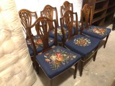 A set of six Georgian mahogany reproduction side chairs, each with a hump back above a pierced splat