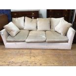 A modern sofa in sand upholstery with down filled cushions, on square supports (70cm x 225cm x