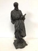 A metal scuplture of a Renaissance Gentleman reading, on plinth, base inscribed to front A.