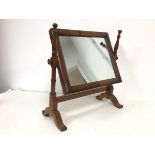 A late Victorian hinged dressing table mirror, the rectangular glass on two turned supports, on