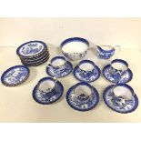 A late 19thc Willow pattern Spode teaset including six teacups (6cm x 7.5cm), nine saucers, ten side
